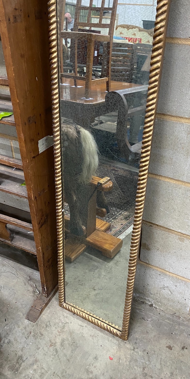 A gilt composition framed wall mirror, width 36cm height 214cm